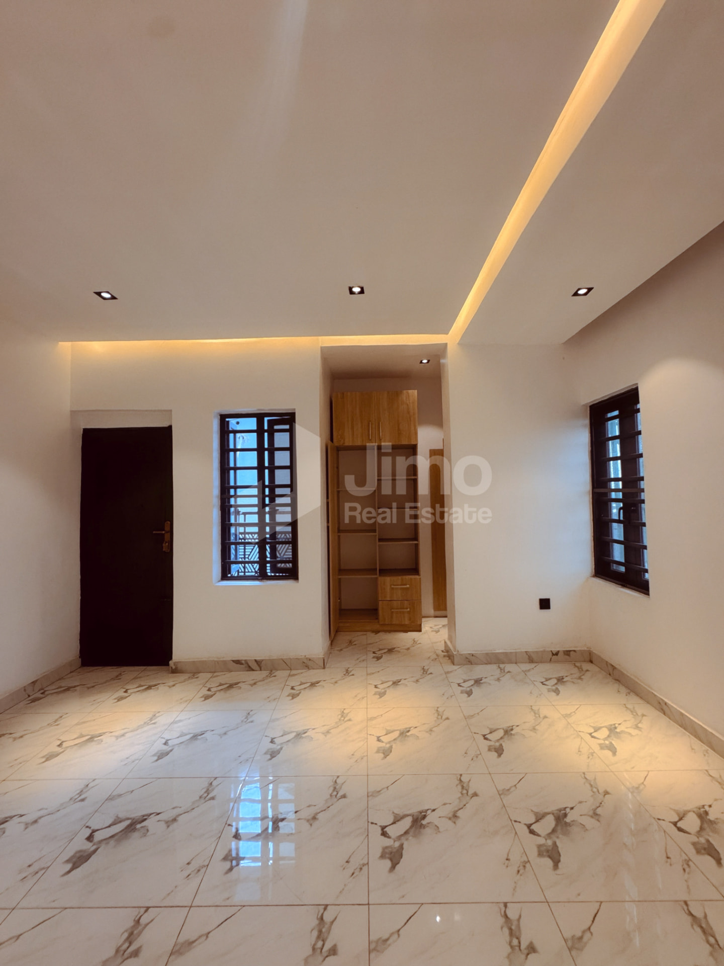 Bedroom with fitted wardrobe and warm cove lighting