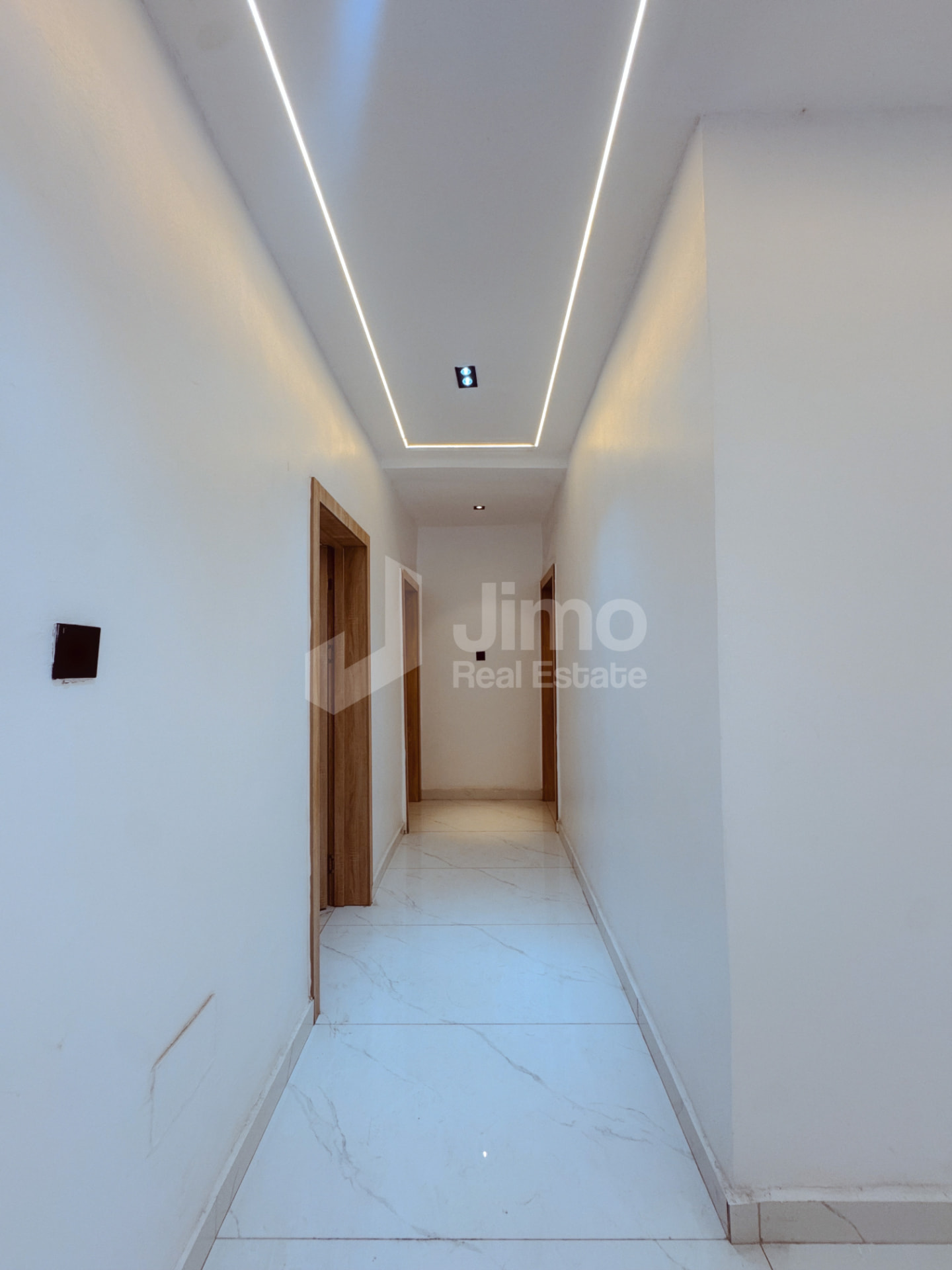 Hallway with LED ceiling lighting leading to the bedrooms